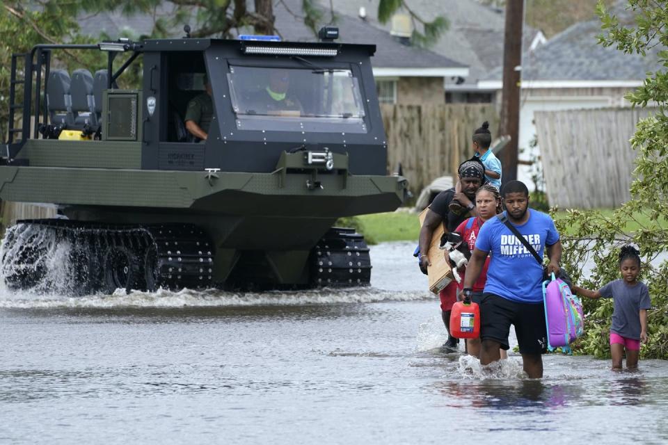 <span class="caption">Rising sea levels are increasing the risks of coastal flooding in Louisiana and other states.</span> <span class="attribution"><a class="link " href="https://newsroom.ap.org/detail/HurricaneIdaPhotoGallery/b0a16982c0a74dceaefd3c22e6525cb2/photo" rel="nofollow noopener" target="_blank" data-ylk="slk:AP Photo/Steve Helber;elm:context_link;itc:0;sec:content-canvas">AP Photo/Steve Helber</a></span>