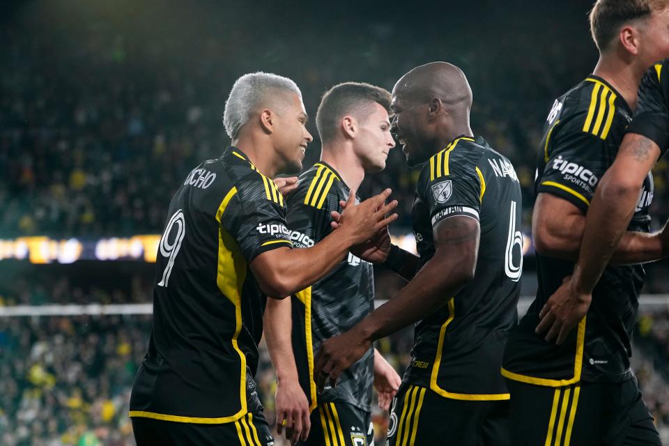 Mar 16, 2024; Columbus, Ohio, USA; Columbus Crew forward Cucho Hernandez (9) celebrates a goal with midfielder Darlington Nagbe (6) during the first half of the MLS soccer match against the New York Red Bulls at Lower.com Field. Mandatory Credit: Adam Cairns-USA TODAY Sports