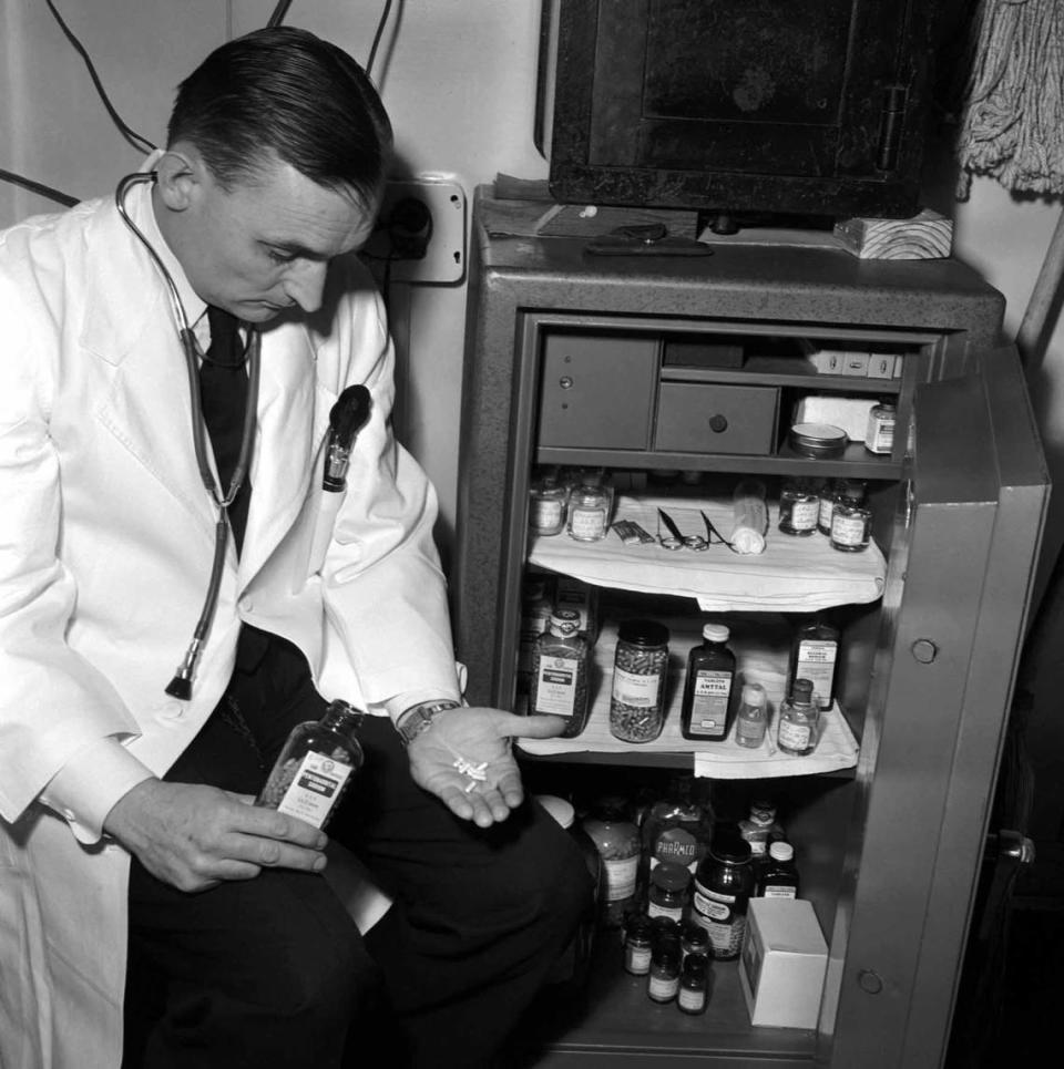 Dr. Harris Isbell examined barbituates at the United States Public Health Service Hospital in April 1950. Dr. Isbell was the Addiction Research Center’s director from 1945 to 1962, a period many considered the lab’s golden age for new discoveries. The hospital, then known as the United States Narcotic Farm, was the first prison for drug addicts in the United States. Its original purpose was to treat people that “voluntarily” were admitted with drug abuse problems and treat them, with mostly experimental treatments. The facility today, located out Leestown Road just past Masterson Station Park, is the Federal Medical Center and is operated by the Federal Bureau of Prisons. This photo ran with one of a series of stories in the Lexington Herald about the fight against drug addiction written by Jack Lewyn. The first story ran April 17, 1950. Herald-Leader Archive Photo