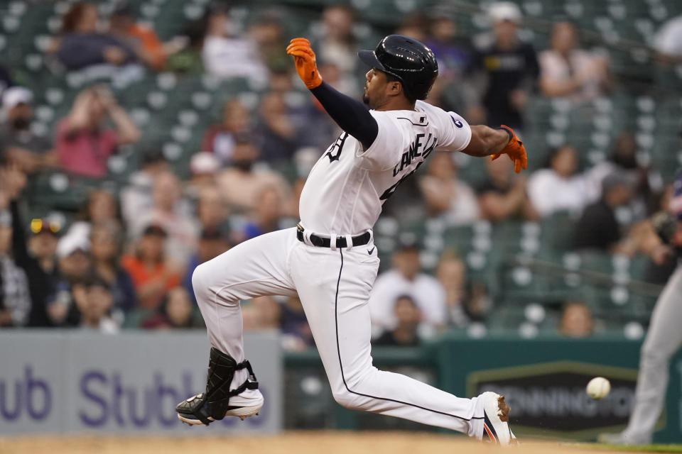 Detroit Tigers' Jeimer Candelario slides into third and beats the throw for a triple during the fifth inning of a baseball game against the Minnesota Twins, Wednesday, June 1, 2022, in Detroit. (AP Photo/Carlos Osorio)