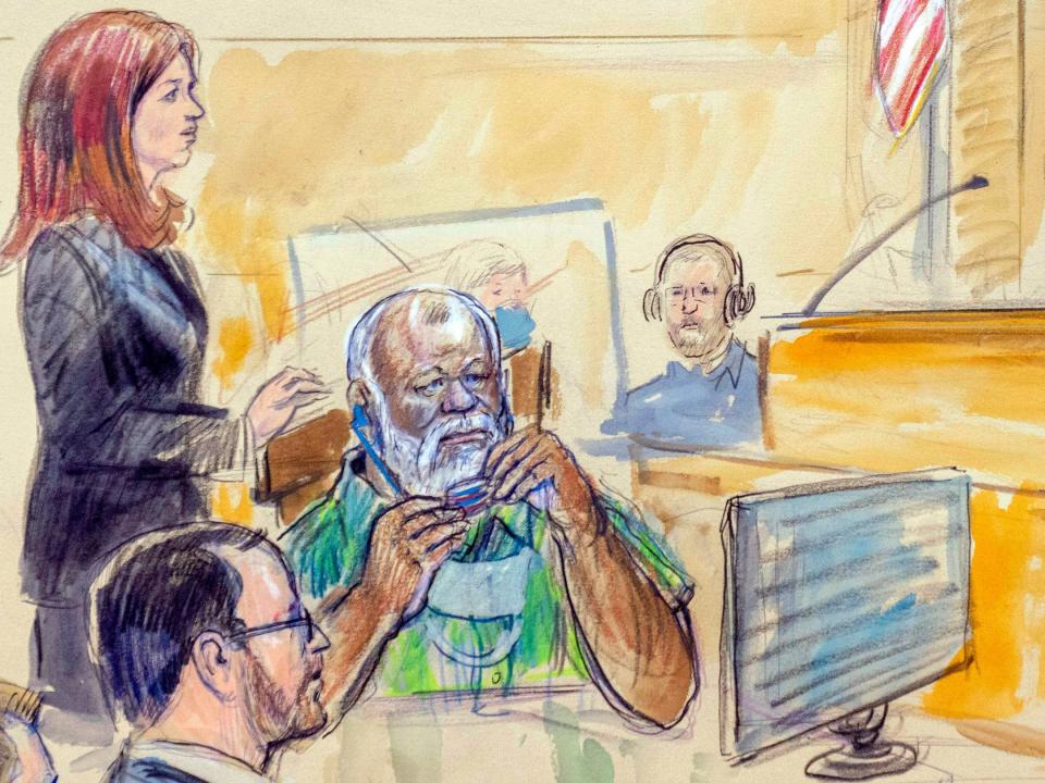 The artist sketch depicts Assistant U.S. Attorney Erik Kenerson, front left, watching as Whitney Minter, a public defender from the eastern division of Virginia, stands to represent Abu Agila Mohammad Mas'ud Kheir Al-Marimi