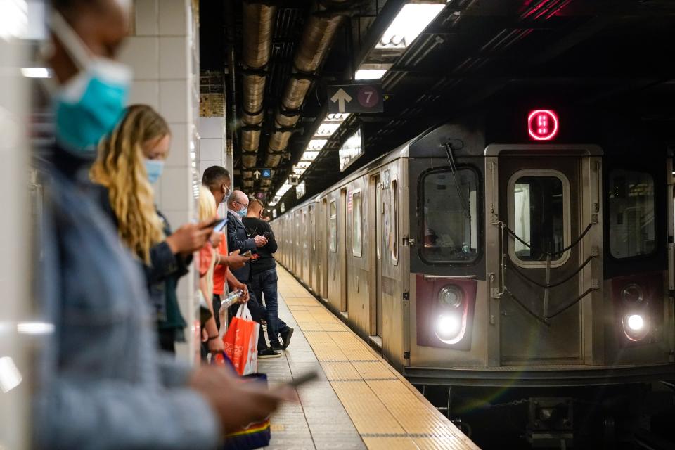 People stand on a platform of the Grand Central Subway Station in New York City as the 5 train arrives. A spike in assaults and harassment incidents in the city’s transit system is threatening its ability to restore ridership to prepandemic levels.