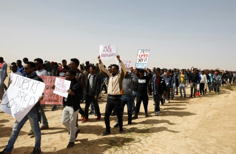 African migrants march from Holot detention centre to the Saharonim Prison, an Israeli detention facility for African asylum seekers, on February 22, 2018, to protest at Israel's policy of prison or deportation for migrants