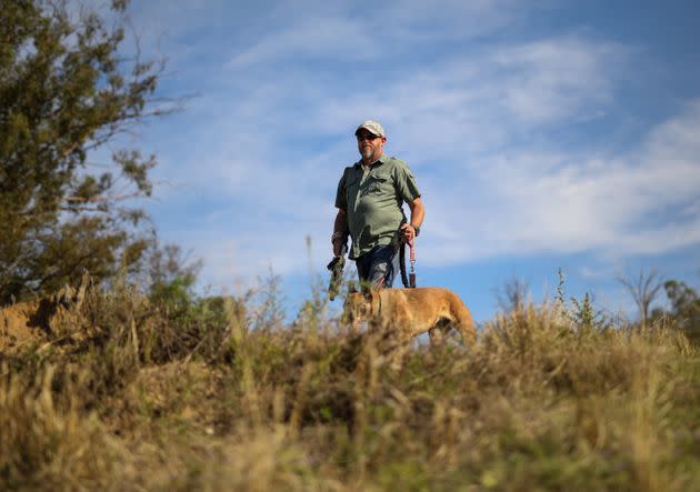 A game range with his dog doing anti poaching work (Photo: CarlFourie via Getty Images)