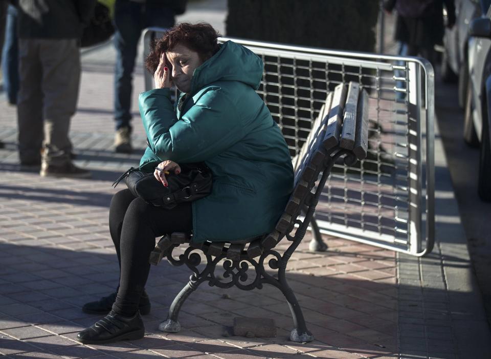 An anti-eviction activist reacts after a family was evicted from their apartment in Madrid