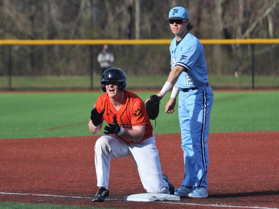 Taunton's Ryan MacDougall celebrates after hitting a two run triple during a Hockomock League game against Franklin.