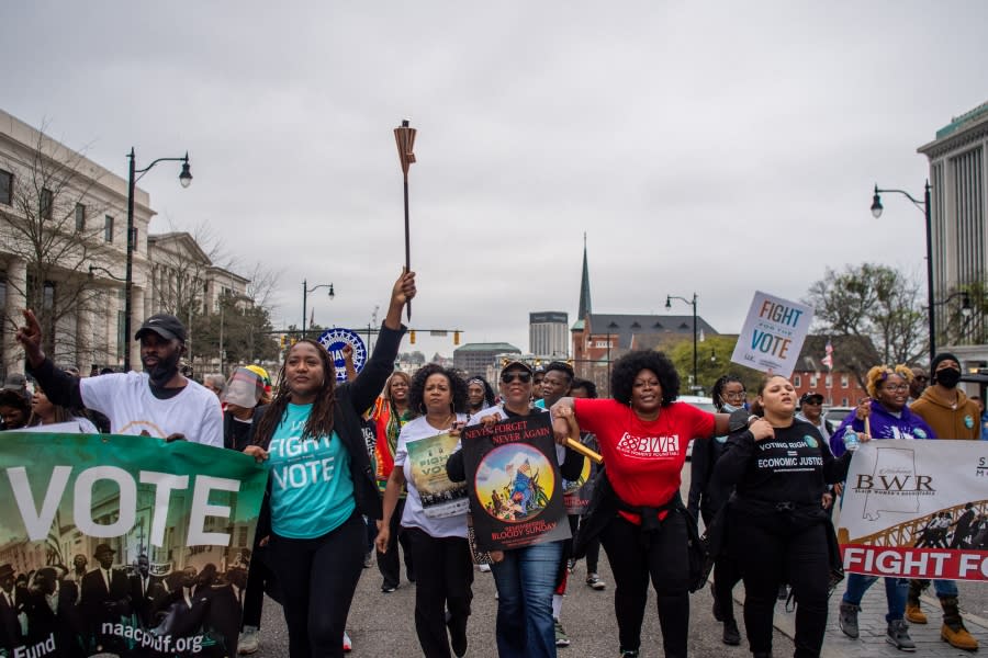 People march toward the Alabama State Capitol on March 11, 2022, in Montgomery, Alabama. Community residents, organizers, and activists concluded the 11-day Selma-to-Montgomery march with a rally at the Alabama State Capitol. In 1965, the march began at the Edmund Pettus Bridge and was met with brutal beatings of civil rights marchers at the hands of law enforcement. The march would later become known as “Bloody Sunday.” The televised attacks were seen all over the nation, prompting public support for the civil rights activists in Selma and for the voting rights campaign. (Photo by Brandon Bell/Getty Images)