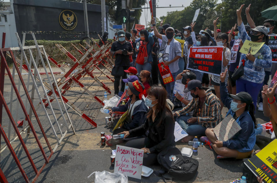 Demonstrators gather close to Indonesian Embassy in Yangon, Myanmar Tuesday, Feb. 23, 2021. Anti-coup protesters gathered outside the Indonesian Embassy following reports that Indonesia was seeking to have fellow members of the Association of Southeast Asian Nations to agree on an action plan over the Myanmar’s coup that would hold the junta to its promise to hold free and fair elections in a year's time. The Indonesia Foreign Ministry has denied the report. (AP Photo)