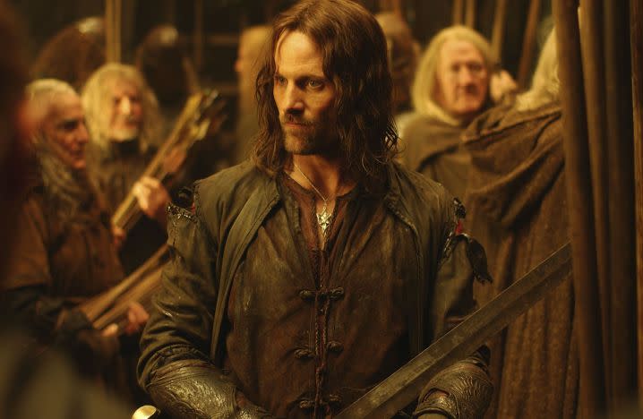 Viggo Mortenson holds a sword in a scene from The Two Towers.