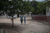 Children walk on the courtyard of the Maison La Providence de Dieu orphanage it Ganthier, Croix-des-Bouquets, Haiti, Sunday, Oct. 17, 2021, where a gang abducted 17 missionaries from a U.S.-based organization. The 400 Mawozo gang, notorious for brazen kidnappings and killings took the group of 16 U.S. citizens and one Canadian, after a trip to visit the orphanage. (AP Photo/Joseph Odelyn)