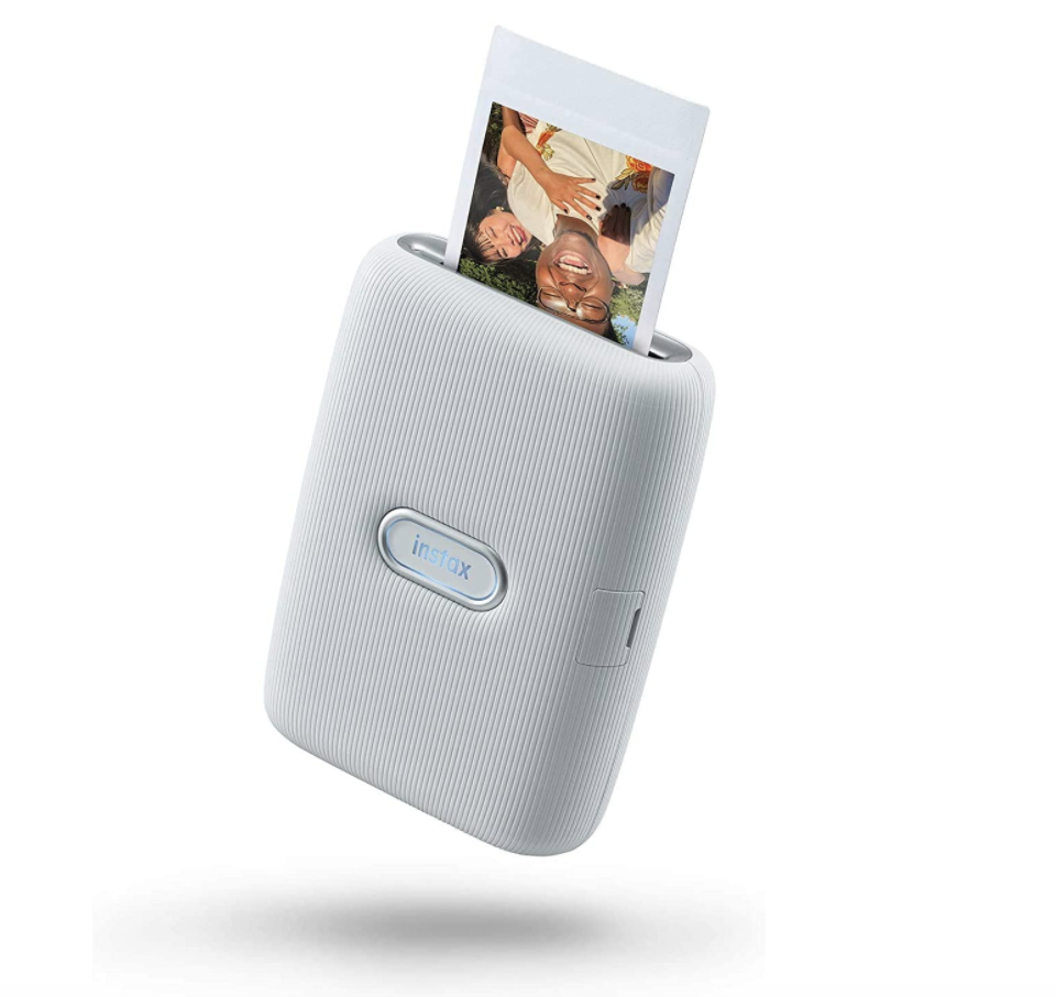 Fujifilm Instax Mini Link Smartphone Printer in white with photo coming out