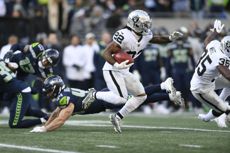 Las Vegas Raiders running back Ameer Abdullah carries against the Seattle Seahawks during the first half of an NFL football game Sunday, Nov. 27, 2022, in Seattle. (AP Photo/Caean Couto)