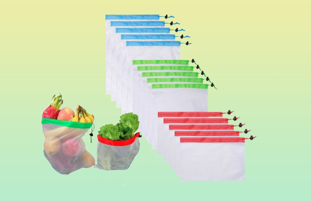 Three sets of mesh bags, five in each. The three sets are in blue, green and red. In the front ground, mesh bags filled with produce. 