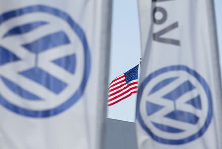 FILE PHOTO: An American flag flies next to a Volkswagen car dealership in San Diego, California September 23, 2015. REUTERS/Mike Blake/File Photo