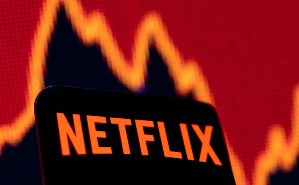 Smartphone with Netflix logo is seen in front of a stock graph in this illustration taken April 19, 2022. REUTERS/Dado Ruvic/Illustration