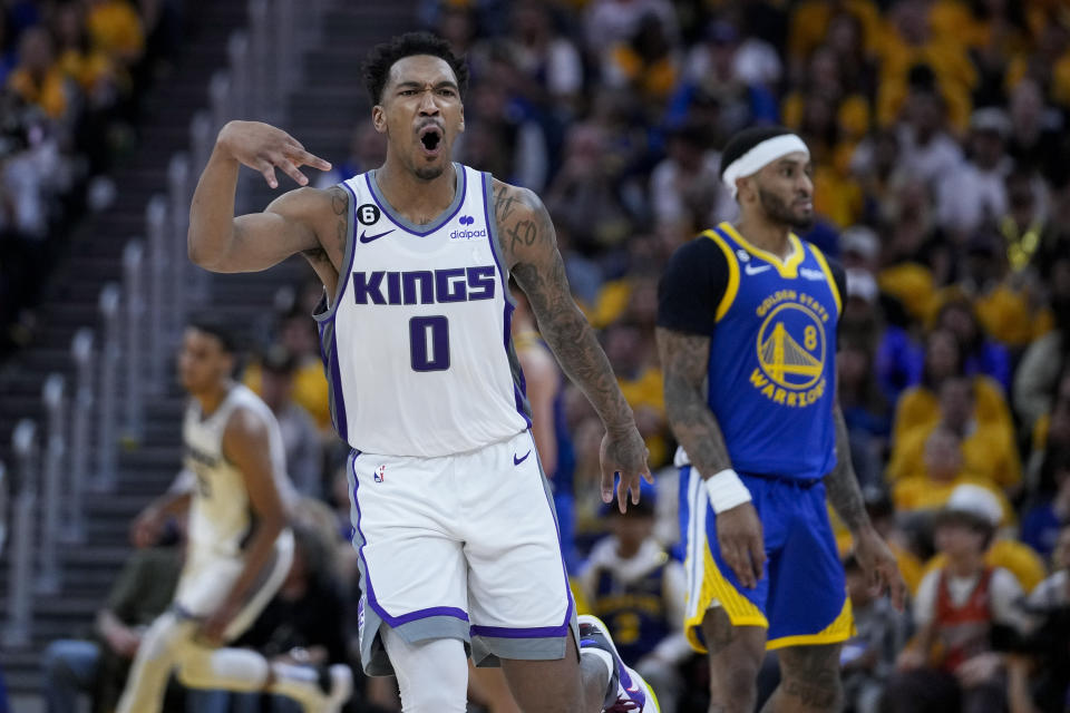 Sacramento Kings' Malik Monk (0) reacts after making a 3-point basket against the Golden State Warriors during the second half of Game 6 of a first-round NBA basketball playoff series in San Francisco, Friday, April 28, 2023. (AP Photo/Godofredo A. Vásquez)