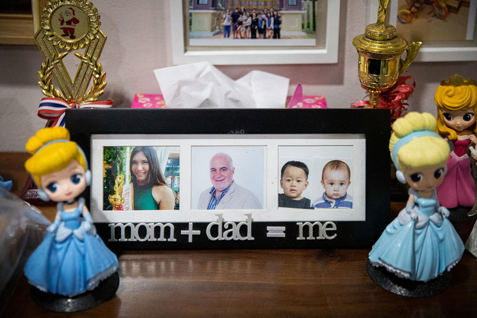 A frame with family photos showing Gina, Lee and their children.<span class="copyright">Lauren DeCicca for TIME</span>