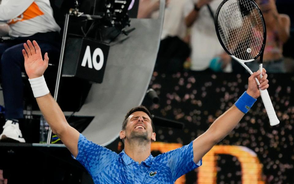 Novak Djokovic of Serbia celebrates after defeating Roberto Carballes Baena of Spain in their first round match at the Australian Open - Aaron Favila/AP