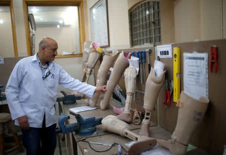 A technician produces artificial limbs at Red Cross Physical Rehabilitation Centre in Erbil, Iraq April 2, 2017. Picture taken April 2, 2017. REUTERS/Suhaib Salem