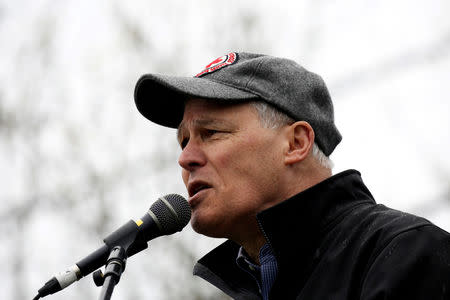 FILE PHOTO: Washington Governor Jay Inslee speaks during a rally at the beginning of the March For Science in Seattle, Washington, U.S. April 22, 2017. REUTERS/David Ryder/File Photo