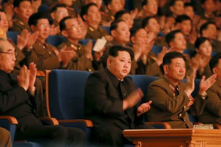 North Korean leader Kim Jong Un (C) applauds during a concert marking the 70th founding anniversary of the Korean People's Army (KPA) military band in this undated photo released by North Korea's Korean Central News Agency (KCNA) in Pyongyang February 23, 2016. REUTERS/KCNA