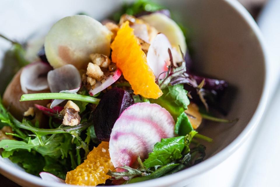 Vegetables provide a chromatic canvas upon which pinkish sauce is drizzled (Getty/iStock)