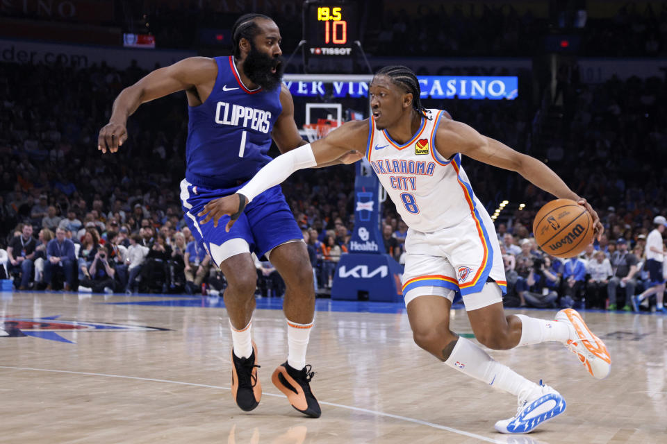 Oklahoma City Thunder forward Jalen Williams (8) drives against Los Angeles Clippers guard James Harden (1) during the first half of an NBA basketball game Thursday, Feb. 22, 2024, in Oklahoma City. (AP Photo/Nate Billings)