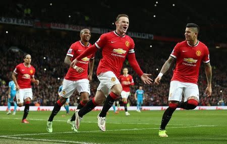 Football - Manchester United v Sunderland - Barclays Premier League - Old Trafford - 28/2/15 Wayne Rooney celebrates with team mates after scoring the first goal for Manchester United from the penalty spot Action Images via Reuters / Carl Recine Livepic