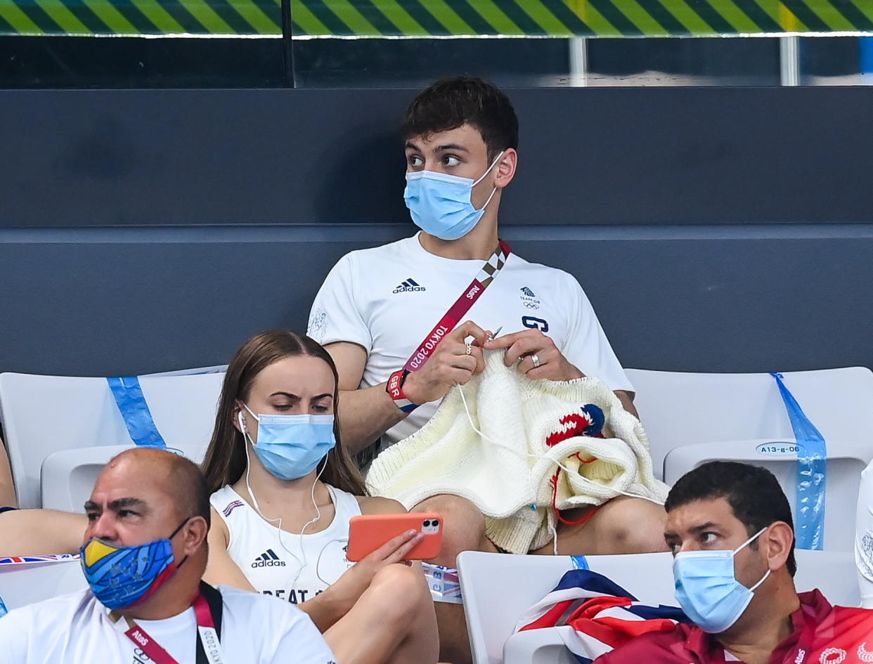 Tom Daley was spotted knitted again during the preliminary round of the men's 3m springboard at the Tokyo Aquatics Centre. (Getty)