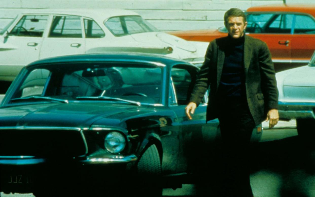 Steve McQueen with the Ford Mustang that co-starred in 'Bullitt', which was released in 1968 - Rex Features