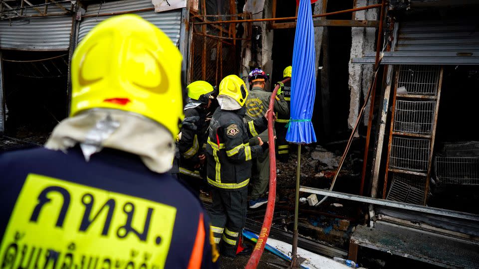 Firefighters attending the scene. - Athit Perawongmetha/Reuters