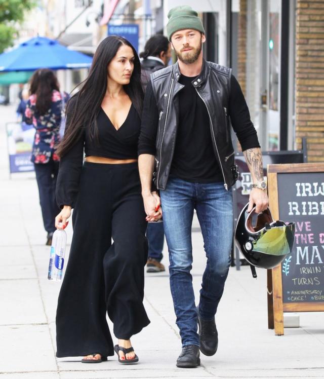 Nikki Bella shares a sweet kiss with husband Artem Chigvintsev outside of  Good Morning America in NY