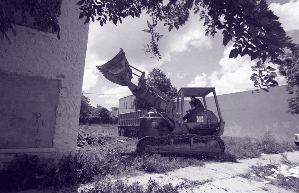 Carollo, then mayor, sits next to the operator of a bulldozer in 1997 as the city tears down an alleged crack house at 1421 NE Miami Ct. A. Enrique Valentin/el Nuevo Herald