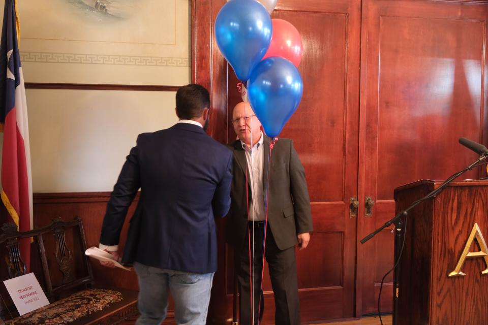 Mayor Cole Stanley is greeted by Pantex Field Manager Jason Armstrong Tuesday at the Amarillo Chamber of Commerce.