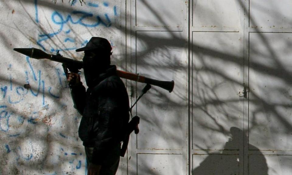 A member of the Hamas security forces patrols in a street in Gaza City.