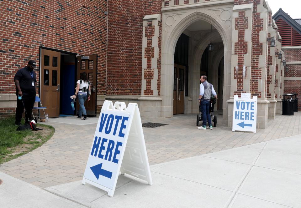 People mill around the school voting area at Bronxville High School on Meadow Avenue in Bronxville, May 16, 2023. 