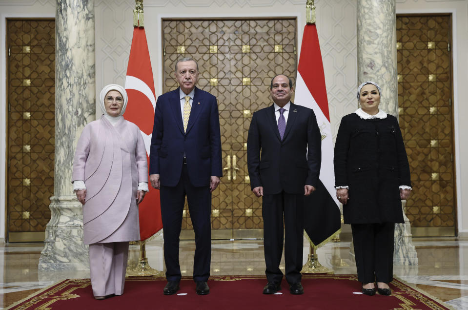 In this handout photo released by Turkish Presidency, Turkey's President Recep Tayyip Erdogan, second left, and his wife Emine Erdogan, left, pose for a photograph with Egyptian President Abdel Fattah Al-Sissi, second right, and his wife Entissar Amer during their meeting at Al-Ittihadiya palace in Cairo, Egypt, Wednesday, Feb. 14, 2024. (Turkish Presidency via AP)