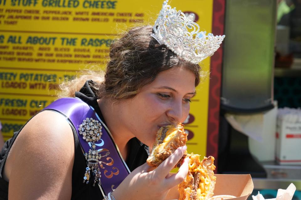 Iowa State Fair Queen Kalayna Durr tries some of the new foods at the Iowa State Fair in 2023.
