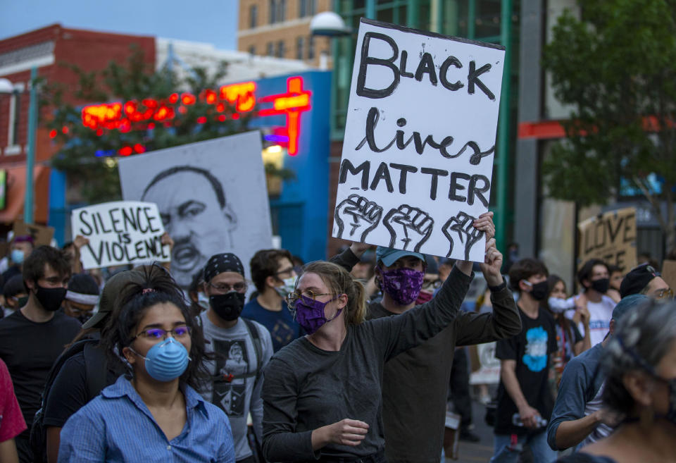 Demonstrators protest the death of George Floyd in downtown Albuquerque, N.M., Sunday, May 31, 2020. Floyd was a black man who died in police custody in Minneapolis on May 25. (AP Photo/Andres Leighton)