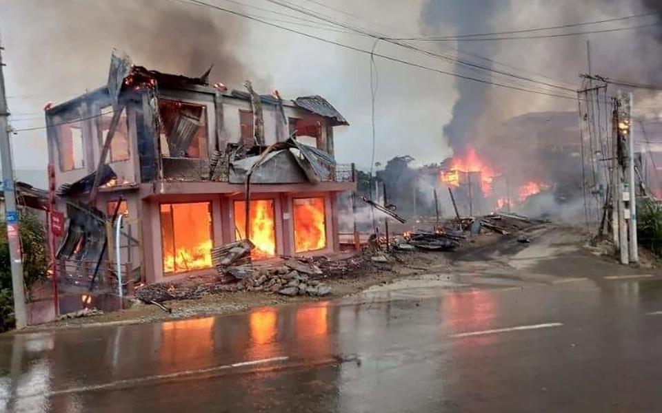 A handout photo made available by The Chinland Post shows burning houses due to military shelling with heavy artillery in Thantlang town, Chin State, - The Chinland Post 