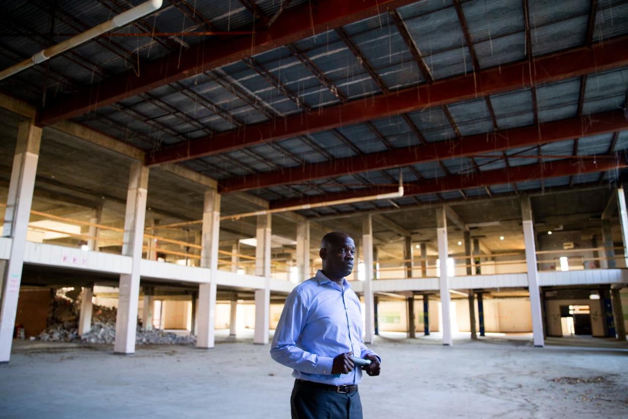 Quincy N. Jones, director of programs of The Works Inc., stands in the former library within the building that used to be Northside High School during a tour of the site in Memphis, Tenn., on Wednesday, Nov. 8, 2023. The Works Inc. is redeveloping the site into Northside Square, a mixed-use project.