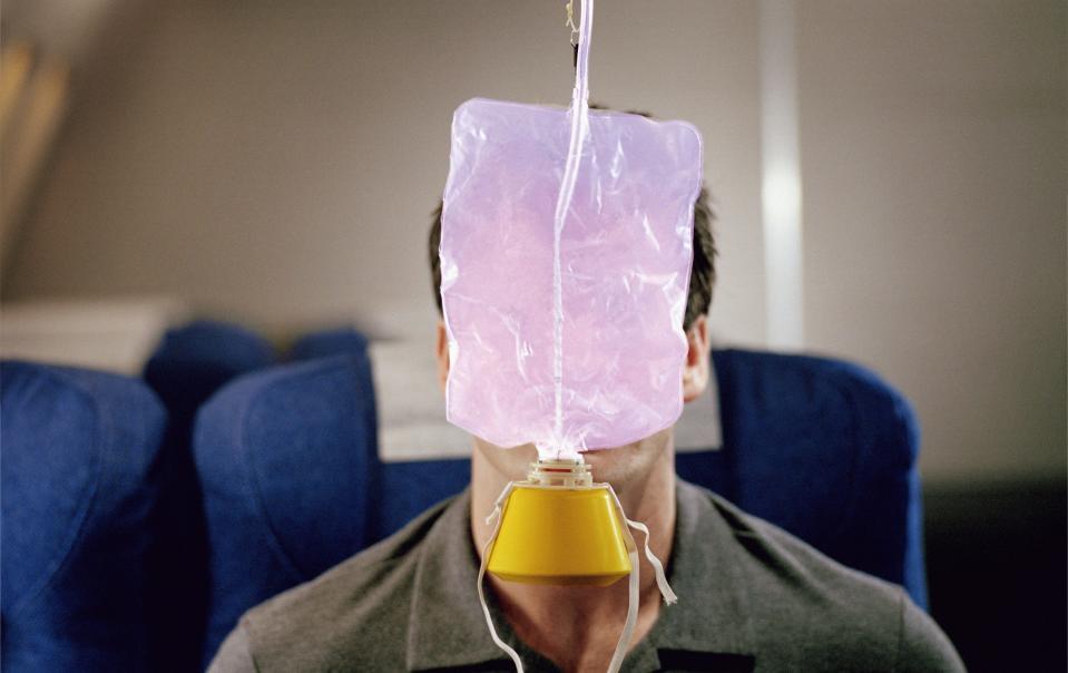 Oxygen mask on a plane - Getty