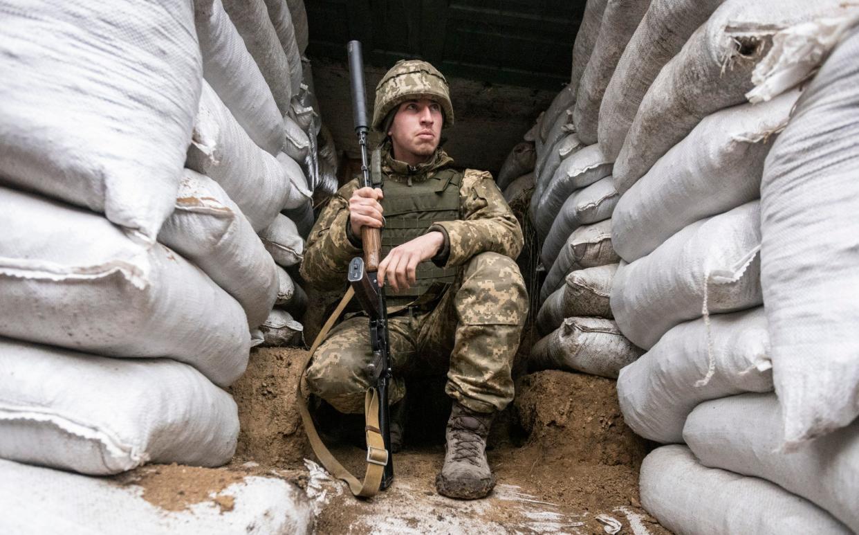 A Ukrainian soldier in the trench on the line of separation from pro-Russian rebels, Mariupol, Donetsk region, Ukraine - AP Photo/Andriy Dubchak