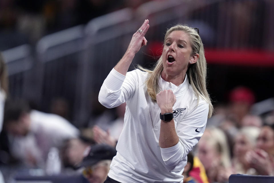 Indiana Fever head coach Christie Sides calls a play during the first half of a WNBA basketball game against the New York Liberty, Saturday, July 6, 2024, in Indianapolis. (AP Photo/Darron Cummings)