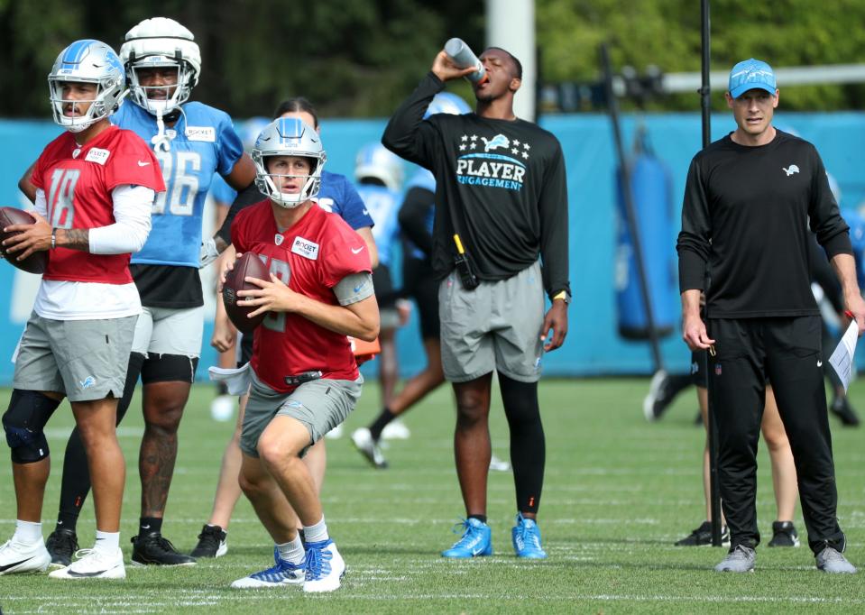 Offensive coordinator Ben Johnson watches Detroit Lions quarterbacks Jared Goff (16) and Adrian Martinez (18) throw during joint practice with the Jacksonville Jaguars in Allen Park, Thursday, Aug. 17, 2023.