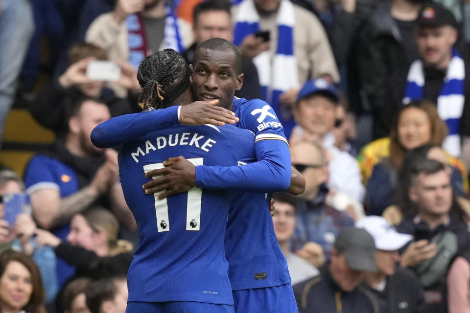 Chelsea's Nicolas Jackson, right, celebrates with Chelsea's Noni Madueke after scoring his side's fourth goal during the English Premier League soccer match between Chelsea and West Ham United at Stamford Bridge stadium in London, England, Sunday, May 5, 2024. (AP Photo/Frank Augstein)