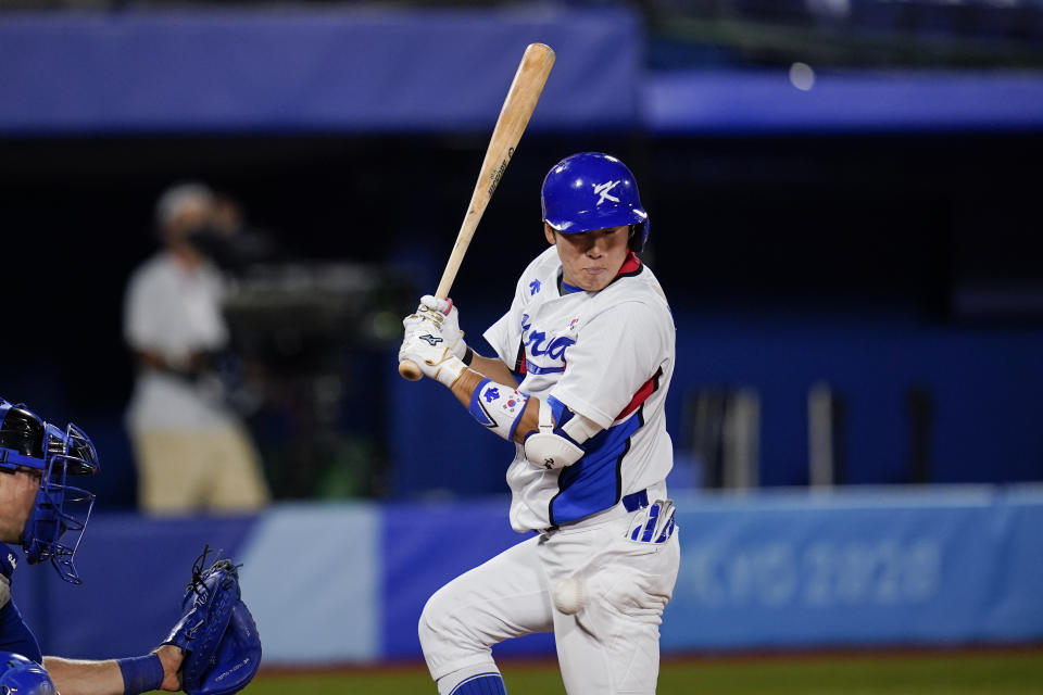 South Korea's Kyoungmin Hur is hit by pitch during the tenth inning of a baseball game against Israel at the 2020 Summer Olympics, Thursday, July 29, 2021, in Yokohama, Japan. South Korea won 6-5. (AP Photo/Sue Ogrocki)