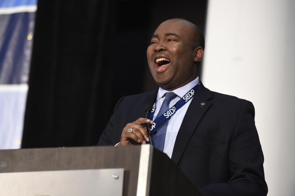 FILE - In this Dec. 14, 2019 file photo, Democrat Jaime Harrison, who is seeking to challenge Republican U.S. Sen. Lindsey Graham, speaks to Democrats gathered at the Spratt Issues Conference in Greenville, S.C. U.S. Sen. Lindsey Graham has been outraised for the first time by his Harrison, Democratic challenger, in a record-breaking quarterly period that sets up a multimillion-dollar grudge match leading into the general election. Harrison announced late Wednesday, April 14, 2020, that he took in $7.36 million in the first three months of 2020, a figure his campaign said brought his total, overall fundraising to nearly $15 million. (AP Photo/Meg Kinnard, File)