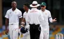 Cricket - Sri Lanka v South Africa -Second Test Match - Colombo, Sri Lanka - July 20, 2018 - South Africa's captain Faf du Plessis (R) and Kagiso Rabada (L) react next to umpire Rod Tucker after the third umpire decision for the unsuccesful LBW wicket for Sri Lanka's Danushka Gunathilaka (2nd L). REUTERS/Dinuka Liyanawatte