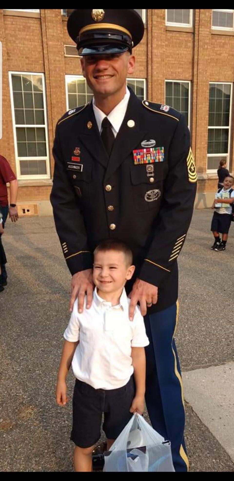 Command Sgt. Maj. Michael Aschinger poses with his son on his first day of school.